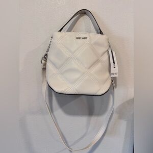 Nine West Skyes Bucket Crossbody bag in the color Milk , Quilted,